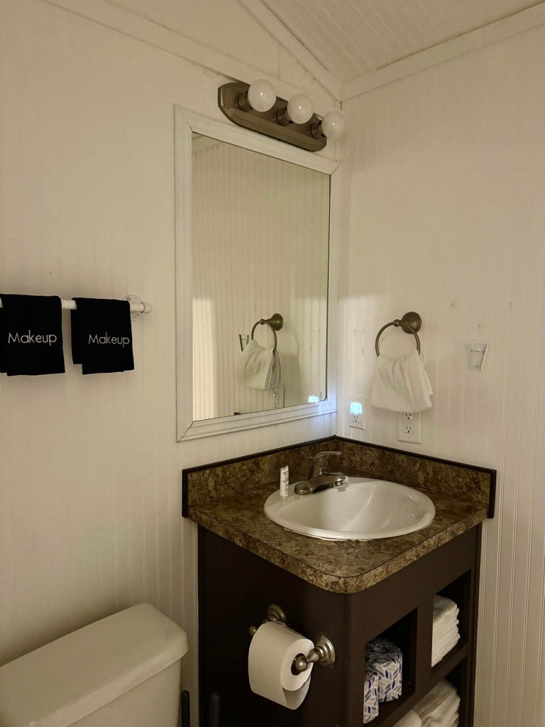 Bathroom vanity and window inside a Jellystone Park Pigeon Forge cabin