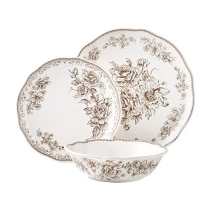 A set of vintage-style dinnerware featuring intricate floral designs in brown, including a large dinner plate, a smaller plate, and a bowl.