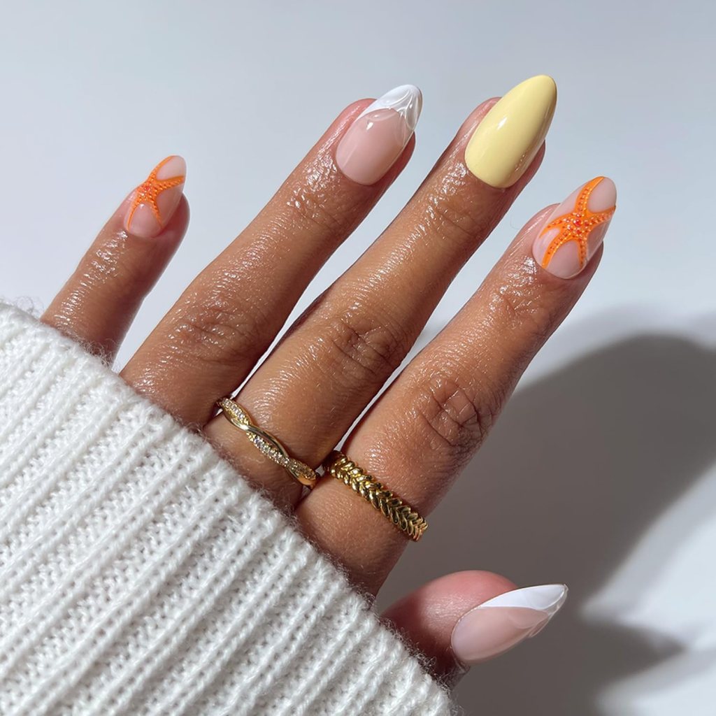 yellow starfish beach nails with bright summer design on almond shaped nails