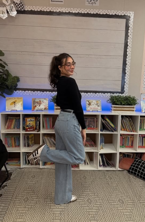 teacher outfit with black top and wide leg jeans