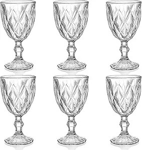 Set of six clear glass goblets with a diamond pattern, suitable for beverages at a festive table setting.