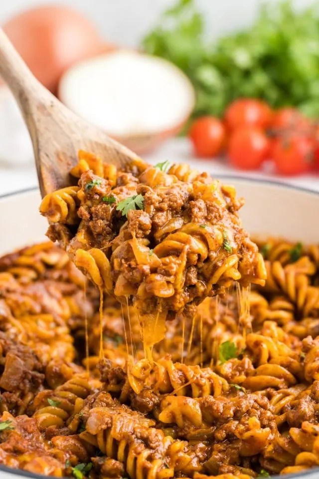 One pan beef enchilada pasta with ground beef, pasta, and cheesy enchilada sauce