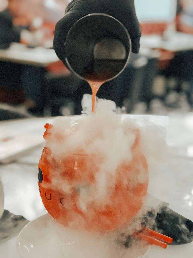 A signature Sugar Factory smoking goblet being prepared with dry ice in Biloxi.