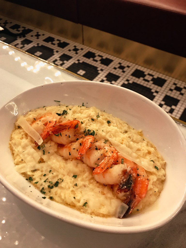 Creamy shrimp and grits served at Sugar Factory Biloxi during a family Christmas getaway on the Mississippi Gulf Coast.