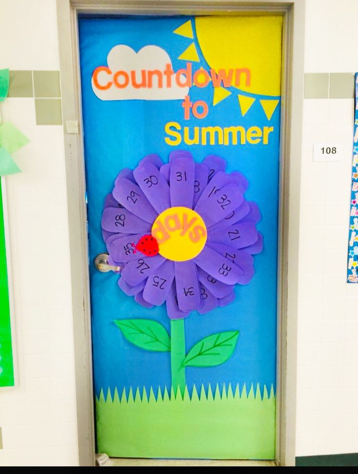 A decorative classroom door featuring a colorful flower with a countdown theme, labeled 'Countdown to Summer' with a sun and banners overhead. The flower has numbered petals indicating days, with a ladybug on the center.