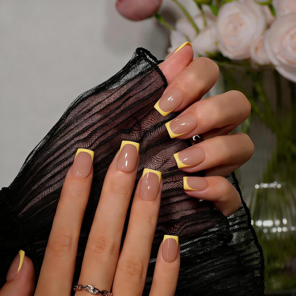 Classic butter yellow French tip square nails with glossy nude base and clean pastel manicure design