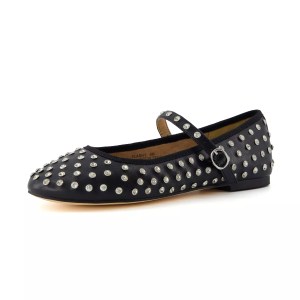 A stylish black Mary Jane flat adorned with silver studs.