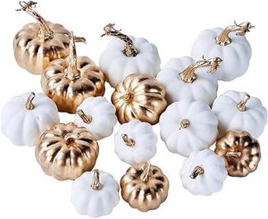 A collection of decorative pumpkins in white and gold, showcasing different shapes and sizes, perfect for autumn decor.