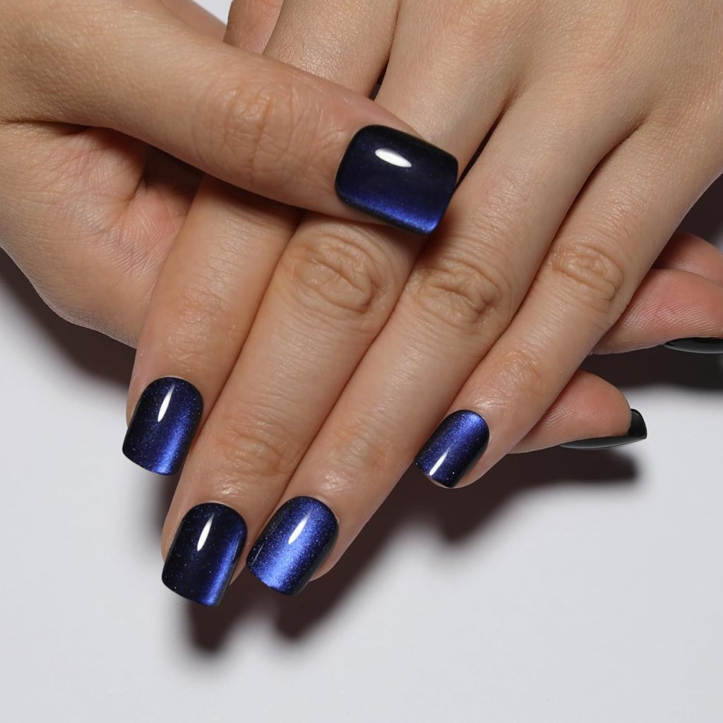 Navy blue cat eye square nails with magnetic shimmer polish and glossy metallic blue finish.