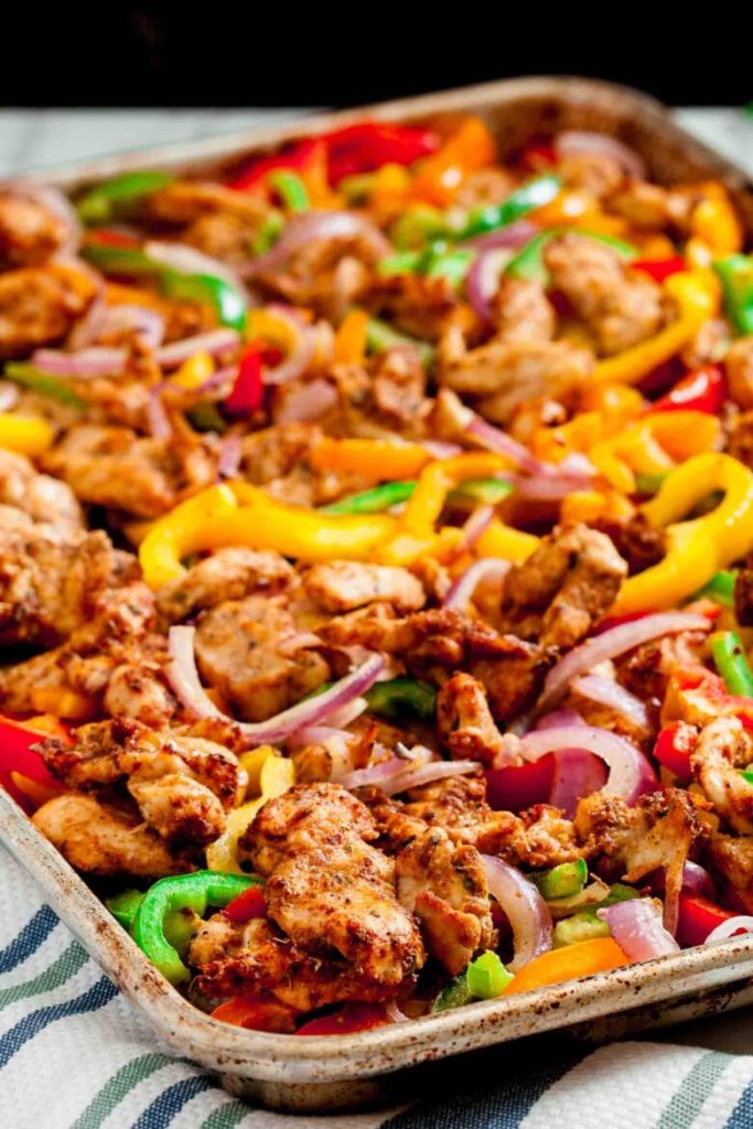 One pan oven baked chicken fajitas with peppers and onions