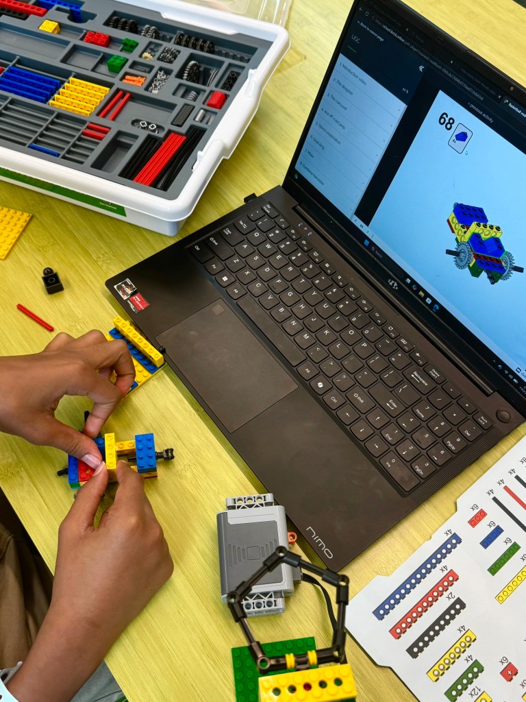 iBrick motorized engineering model taking shape beside online directions
