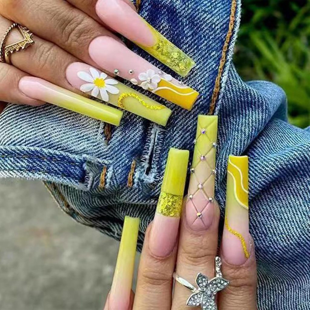 Butter yellow floral nails with 3D flower accent nail art and textured pastel swirl details