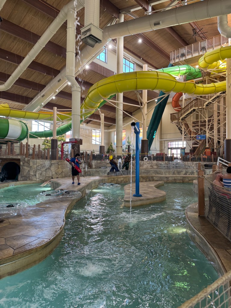 Indoor water park at Great Wolf Lodge Grapevine featuring colorful water slides, pools and interactive water features.