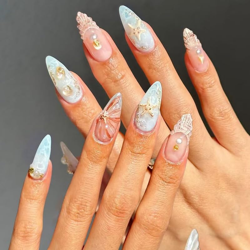 Pearl shell ocean nails with 3D starfish accents, seashell textures, and glossy mermaid-inspired manicure design