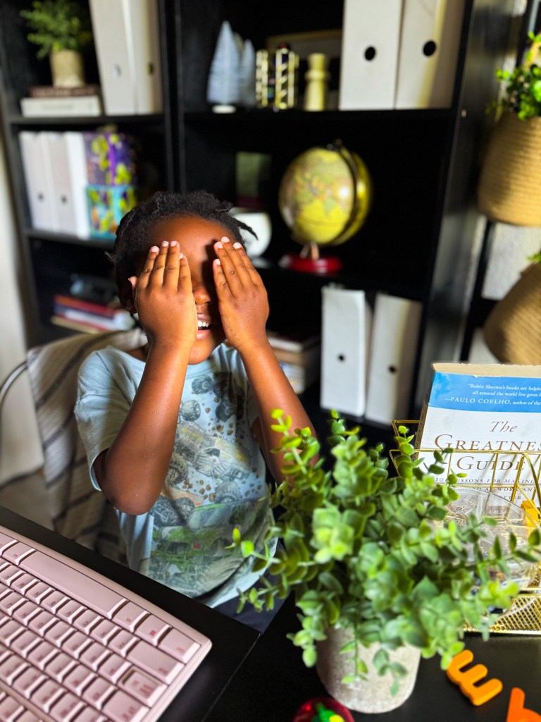 Child doing a movement activity during a hands-on kindergarten homeschool phonics lesson
