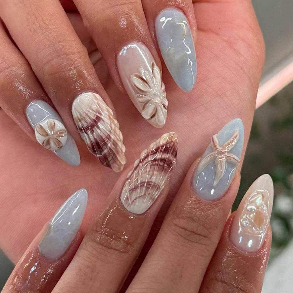3d seashell beach nails with ocean inspired design on glossy acrylic almond shaped nails