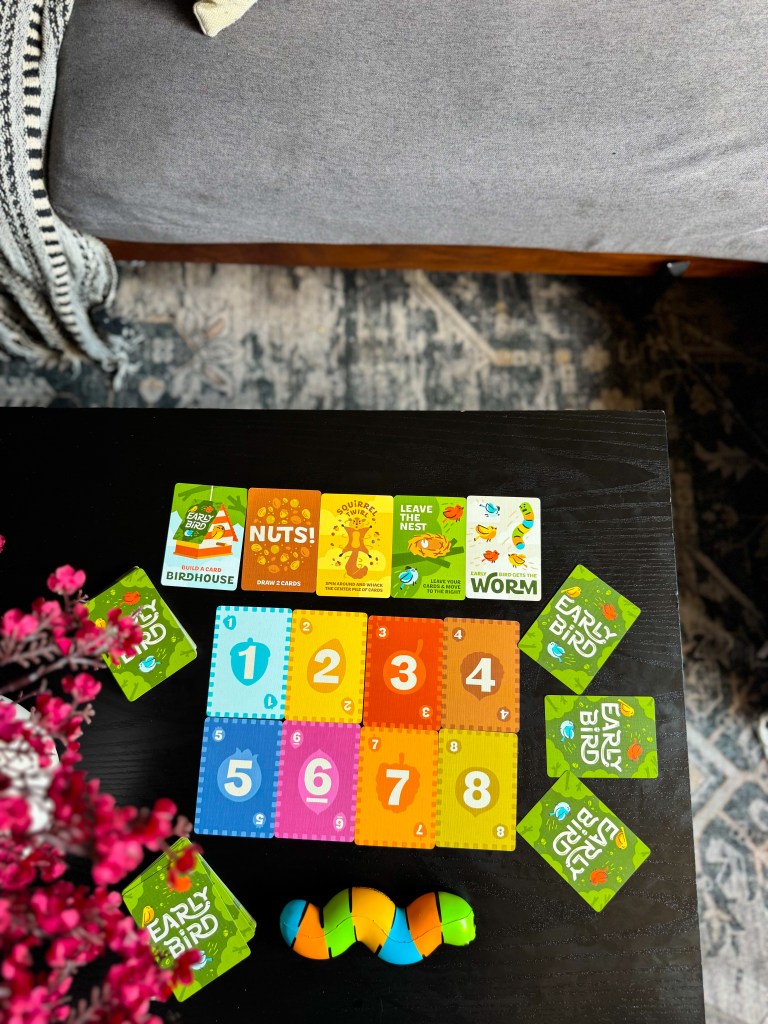 Early Bird card game setup with numbered cards, challenge cards, and worm game piece