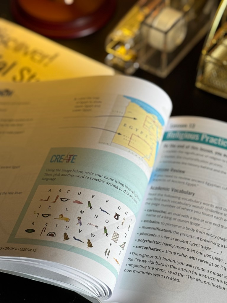 An open educational workbook page from Discover! Social Studies Grade 6, featuring a lesson on ancient Egypt with a section for writing names in hieroglyphics, illustrated with character symbols.