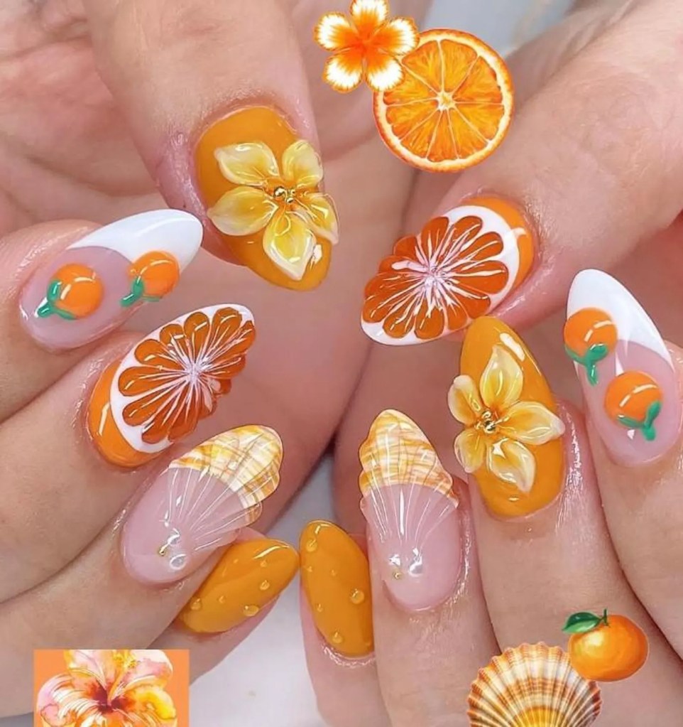 Almond nails with orange slice fruit nail art and small floral accents