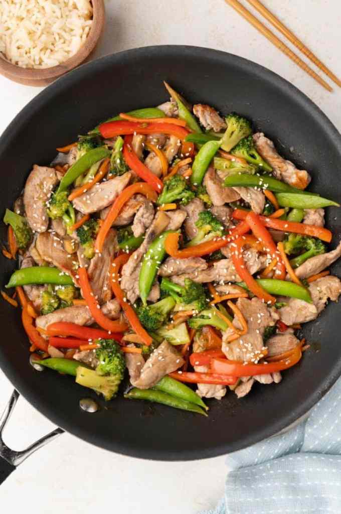 Mongolian pork stir fry with vegetables and a sweet savory sauce for a quick weeknight dinner.