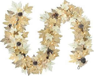 A decorative garland made of autumn leaves and pinecones, featuring warm lights, ideal for Thanksgiving or fall-themed decor.