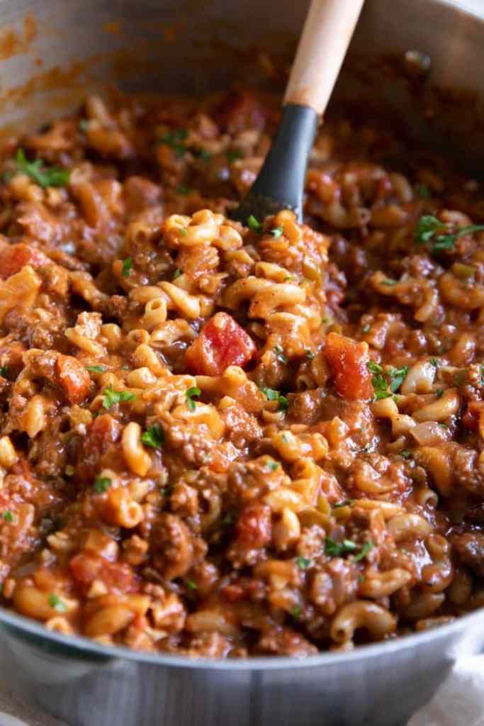 Easy American goulash with ground beef, macaroni, and tomato sauce for a quick weeknight dinner