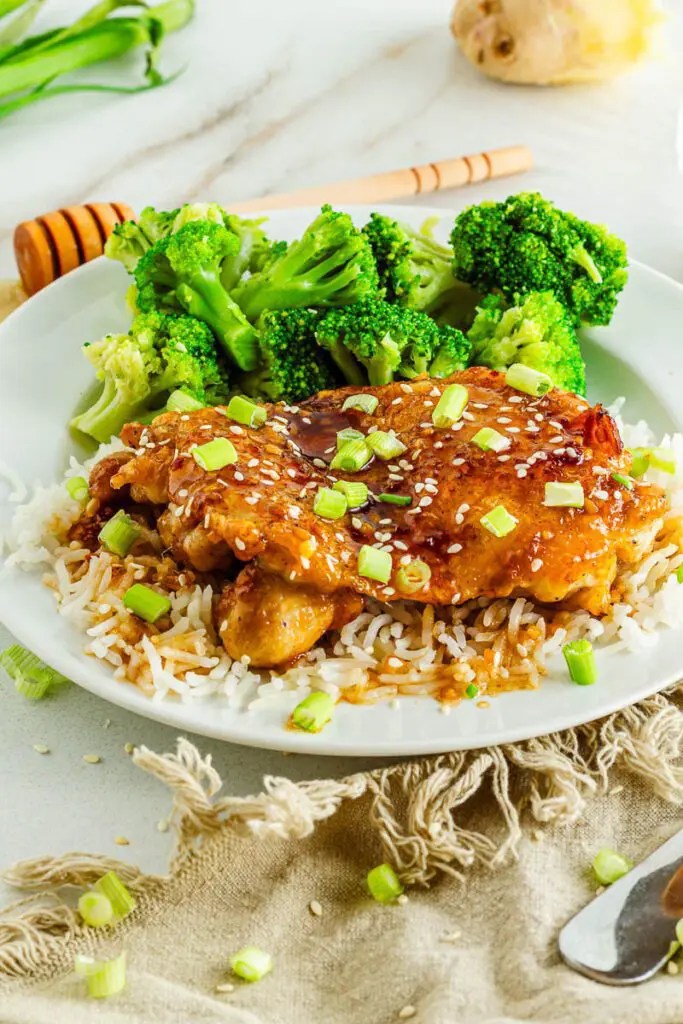 Honey ginger chicken with garlic, ginger, and a sticky sauce served over rice for an easy dinner.