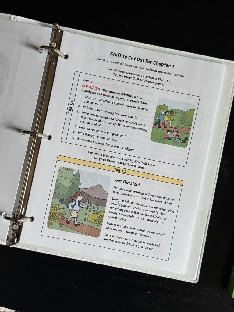 An open binder page featuring activity instructions for Real Science 4 Kids Book 5, including prompts to cut out pieces and answer questions, along with colorful illustrations of children engaging with nature.